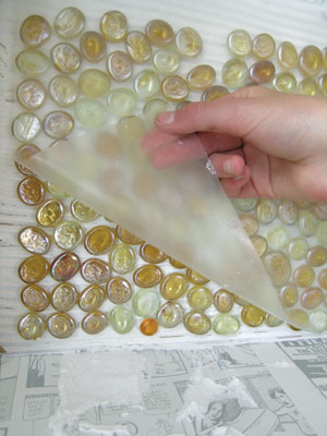 4. Carefully pick up the sheet of glass globs and set it into the mastic with the clear mounting sheet facing you. Allow the mastic to set several hours, then gently remove the clear sheet.